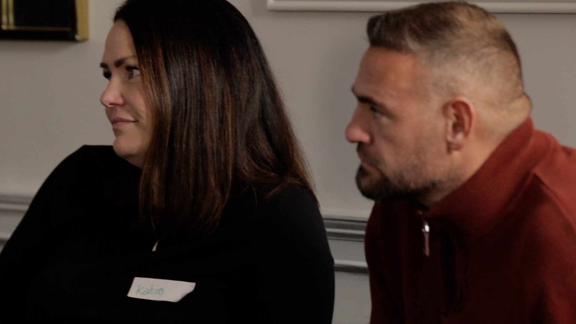 Katie and Johnathon listening during a Coach Recruitment workshop
